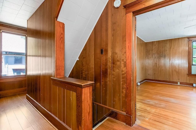 2312 Maple Ave, Leavenworth, KS 66048 - stairway with wood walls, hardwood / wood-style flooring, and lofted ceiling
