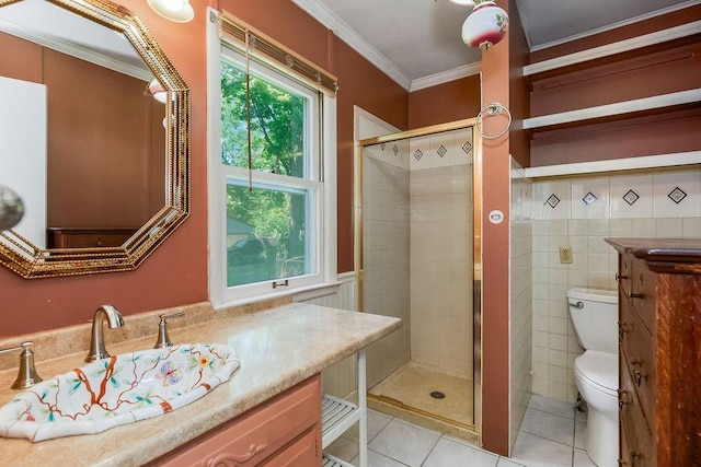2312 Maple Ave, Leavenworth, KS 66048 - full bath featuring tile patterned floors, toilet, ornamental molding, a stall shower, and vanity