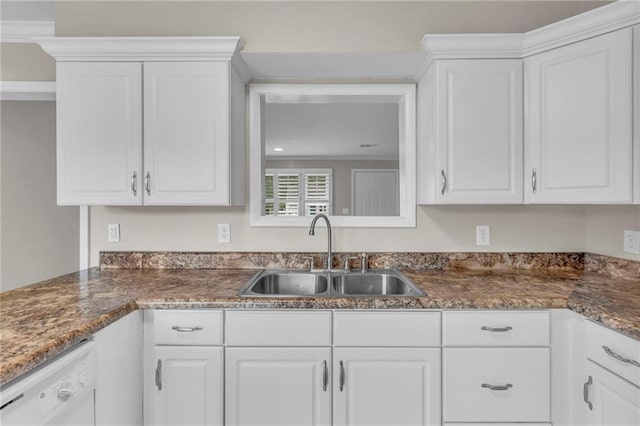 kitchen with a sink, white cabinetry, and dishwasher