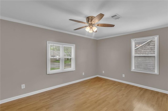 unfurnished room with baseboards, visible vents, and light wood-style flooring