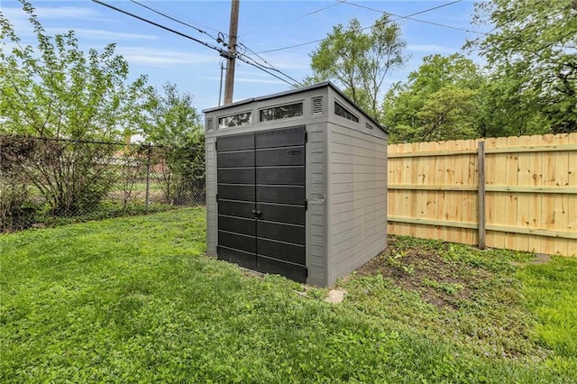 view of shed featuring a fenced backyard