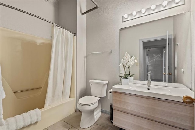 bathroom with toilet, tile patterned floors, shower / tub combo, and vanity