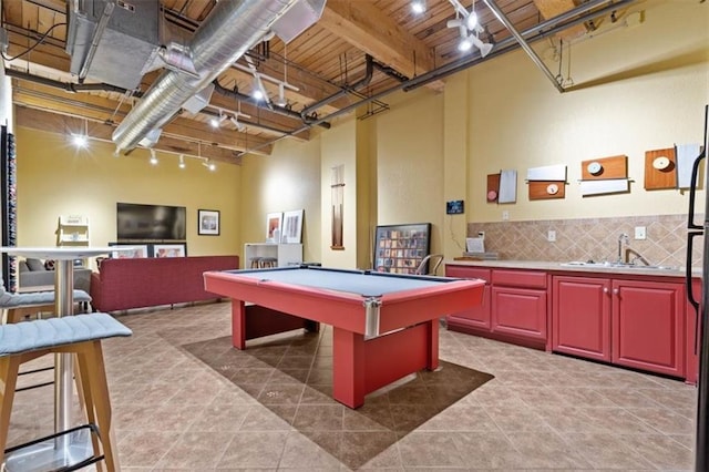 rec room with a sink, track lighting, light tile patterned floors, and pool table