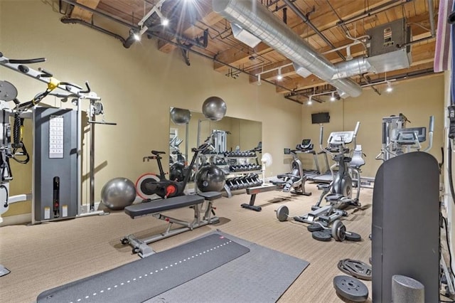 gym with carpet floors and baseboards