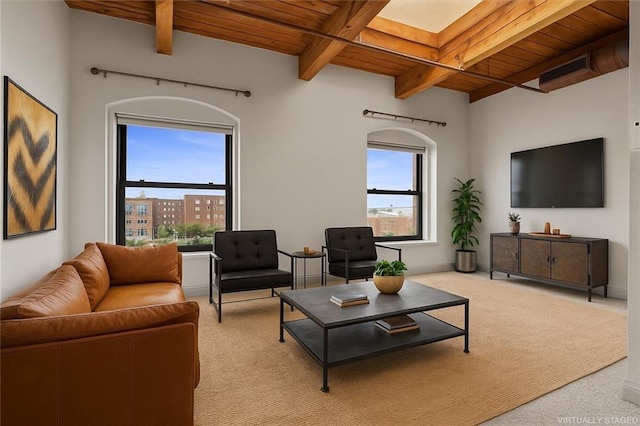 609 Central St Unit 1501, Kansas City, MO 64105 - living area featuring a wooden ceiling with exposed beams and light carpet