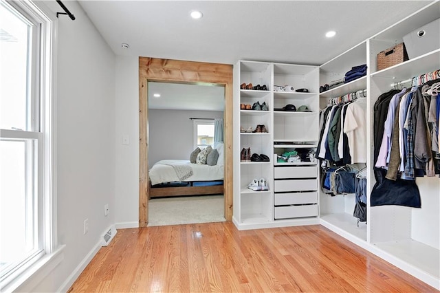 spacious closet with wood finished floors