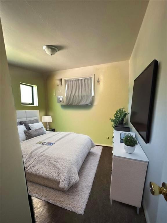 4714 Norton Ave, Kansas City, MO 64130 - bedroom with baseboards and dark carpet