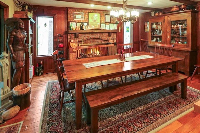 12 Woodland Trl, Warrensburg, MO 64093 - dining area featuring hardwood / wood-style flooring and a chandelier