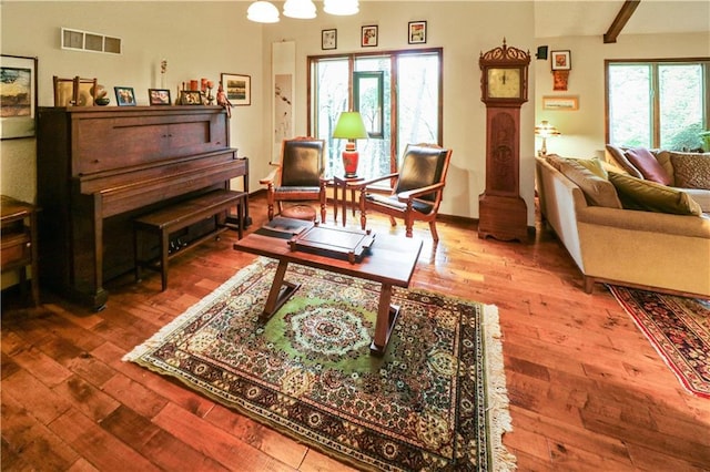 12 Woodland Trl, Warrensburg, MO 64093 - living room featuring wood finished floors and beam ceiling