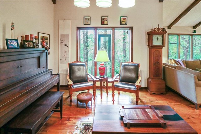 12 Woodland Trl, Warrensburg, MO 64093 - living area with wood finished floors and beam ceiling