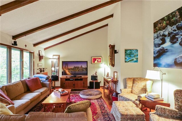 12 Woodland Trl, Warrensburg, MO 64093 - living room with beamed ceiling, wood finished floors, and high vaulted ceiling
