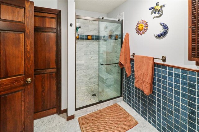12 Woodland Trl, Warrensburg, MO 64093 - full bath with a shower stall and a wainscoted wall
