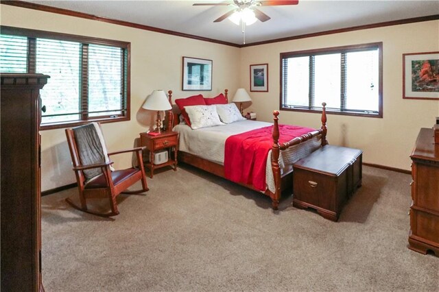 12 Woodland Trl, Warrensburg, MO 64093 - carpeted bedroom with multiple windows, ornamental molding, baseboards, and ceiling fan