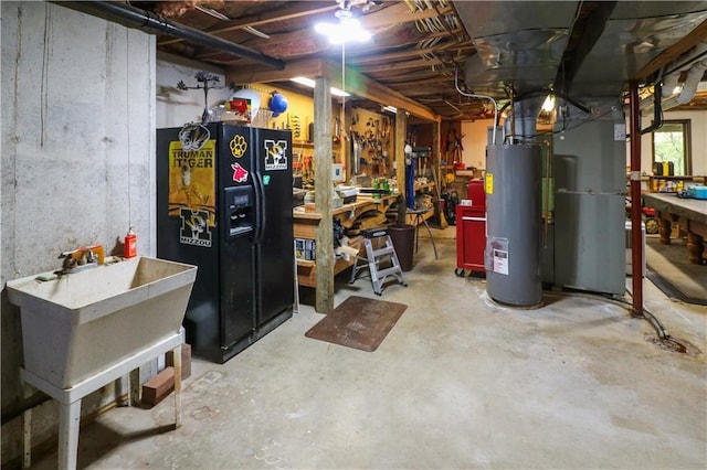 12 Woodland Trl, Warrensburg, MO 64093 - basement with black fridge, water heater, and heating unit