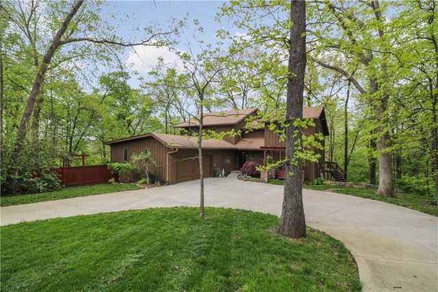 12 Woodland Trl, Warrensburg, MO 64093 - mid-century home featuring concrete driveway and a garage