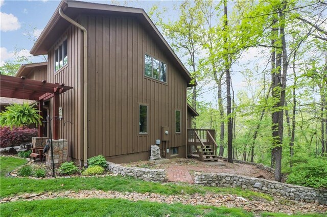 12 Woodland Trl, Warrensburg, MO 64093 - view of side of property featuring a deck