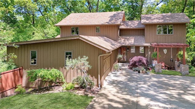 12 Woodland Trl, Warrensburg, MO 64093 - view of front of property with roof with shingles and a patio area