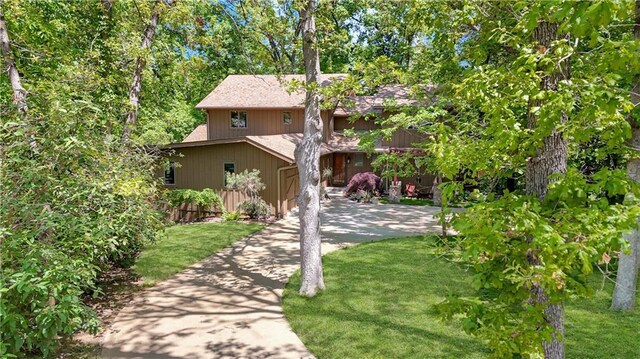 12 Woodland Trl, Warrensburg, MO 64093 - view of front of property featuring a front yard and concrete driveway