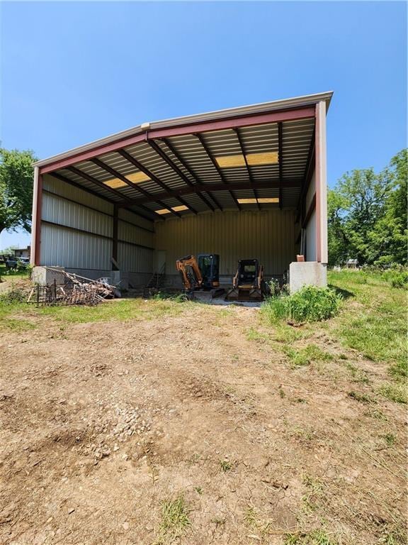15921 Cantrell Rd, Bonner Springs, KS 66012 - view of pole building featuring a carport and dirt driveway