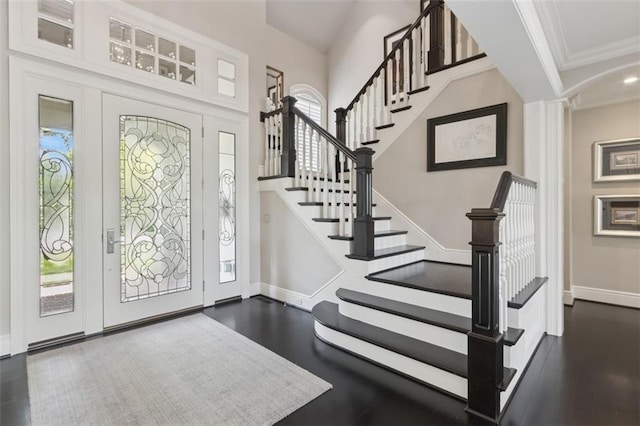 1901 Stratford Rd, Mission Hills, KS 66208 - foyer featuring crown molding, dark wood-type flooring, baseboards, and stairway