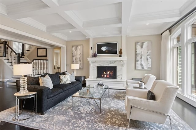 1901 Stratford Rd, Mission Hills, KS 66208 - living room with coffered ceiling, a high end fireplace, beamed ceiling, crown molding, and stairway