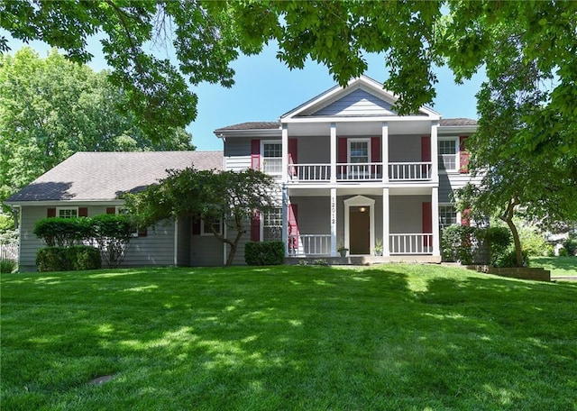12012 Ensley Ln, Leawood, KS 66209 - greek revival inspired property featuring a balcony, a porch, and a front lawn