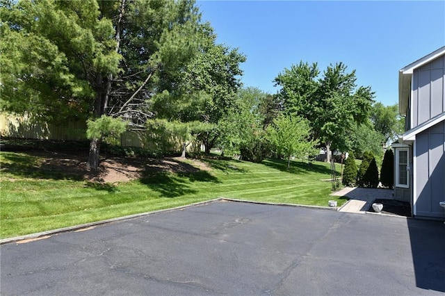 12012 Ensley Ln, Leawood, KS 66209 - view of grassy yard featuring a patio area