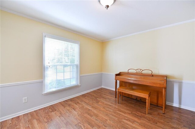 12012 Ensley Ln, Leawood, KS 66209 - office space with wood finished floors, crown molding, and baseboards