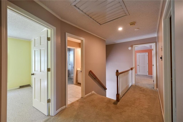 12012 Ensley Ln, Leawood, KS 66209 - hallway with an upstairs landing, light carpet, ornamental molding, a textured ceiling, and baseboards