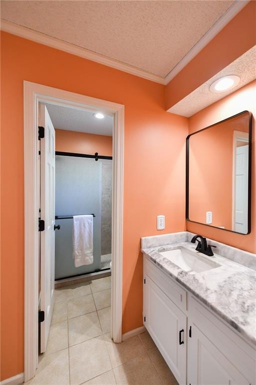 12012 Ensley Ln, Leawood, KS 66209 - bathroom with vanity, crown molding, a textured ceiling, baseboards, and tile patterned flooring