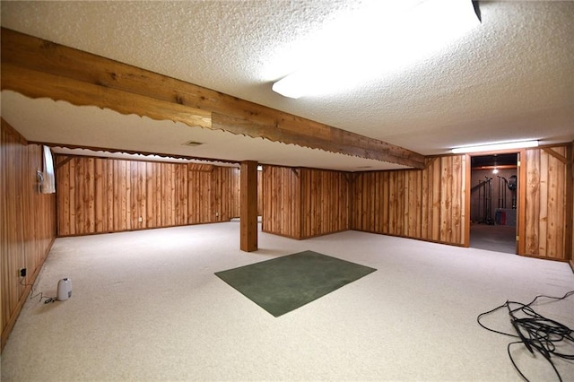12012 Ensley Ln, Leawood, KS 66209 - finished basement with a textured ceiling, carpet flooring, and wooden walls