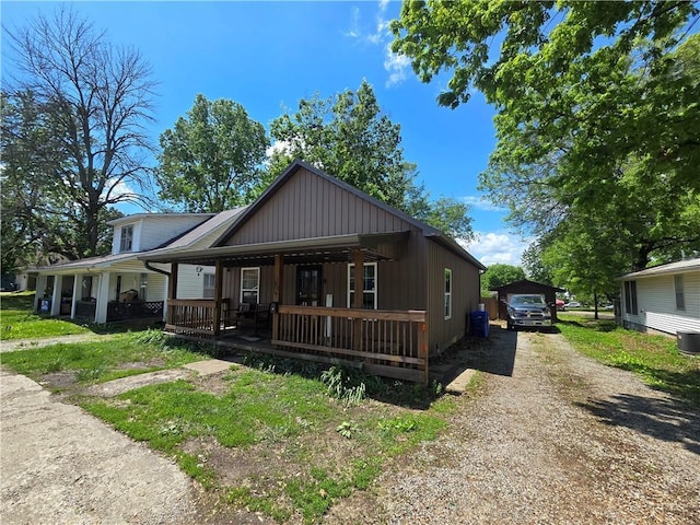 1824 S Grand Ave, Sedalia, MO 65301 - view of front of home with covered porch and dirt driveway