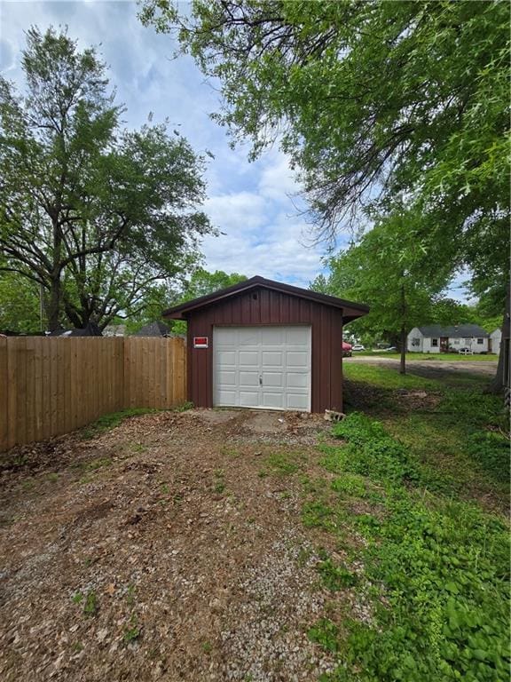 1824 S Grand Ave, Sedalia, MO 65301 - detached garage featuring fence and driveway