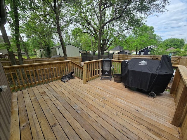 1824 S Grand Ave, Sedalia, MO 65301 - deck featuring area for grilling and a fenced backyard