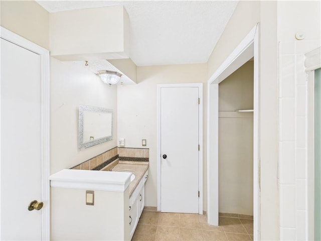 bathroom with vanity and tile patterned flooring