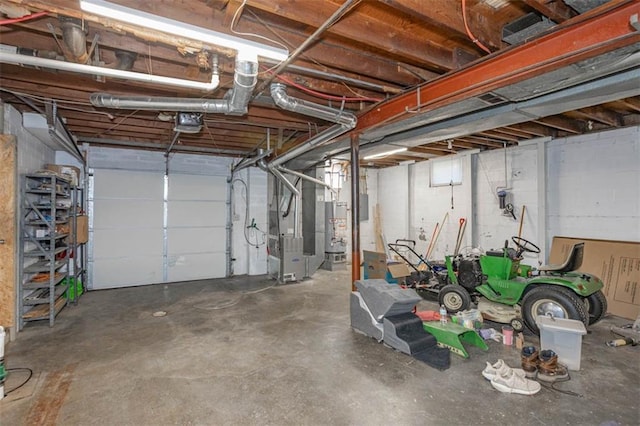 garage with heating unit and gas water heater