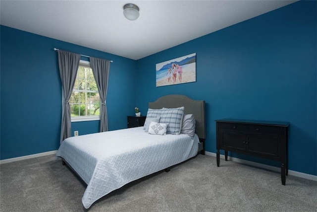 bedroom featuring carpet flooring and baseboards