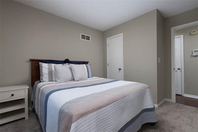 bedroom featuring carpet floors and baseboards