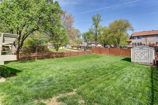 view of yard featuring a storage shed and an outdoor structure