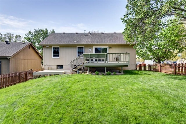 back of property featuring a deck and a patio area