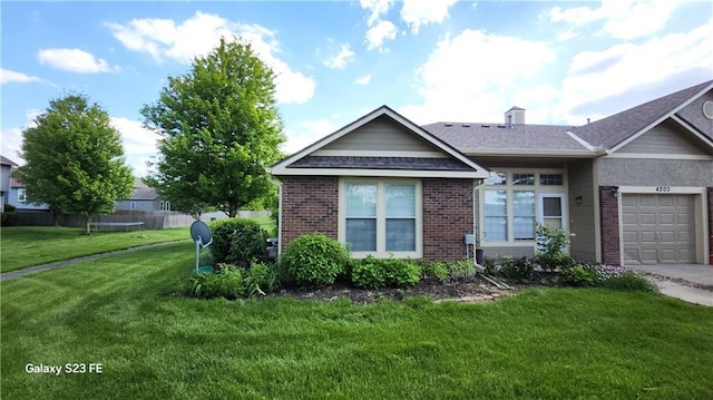 single story home featuring fence, brick siding, driveway, a garage, and a front lawn