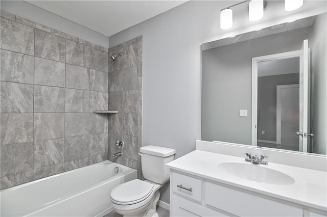 bathroom featuring vanity, washtub / shower combination, and toilet