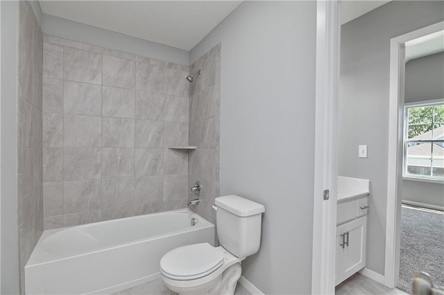 bathroom with vanity, shower / bathing tub combination, baseboards, and toilet