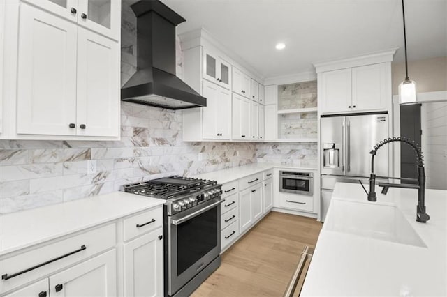 2608 NE Amanda Ln, Blue Springs, MO 64029 - kitchen featuring high quality appliances, wall chimney exhaust hood, open shelves, white cabinetry, and recessed lighting