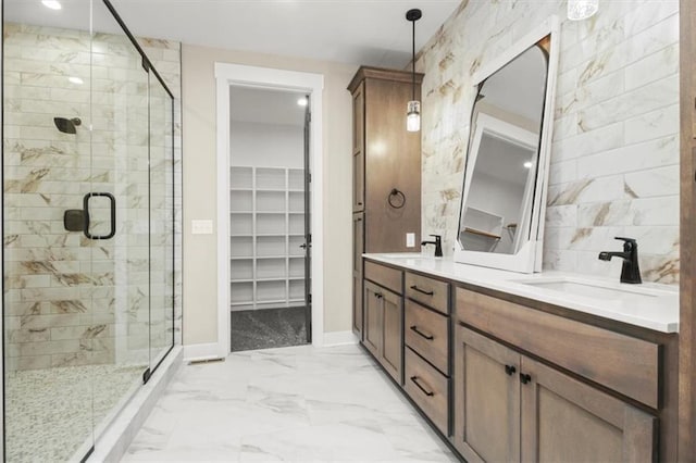 2608 NE Amanda Ln, Blue Springs, MO 64029 - full bathroom with double vanity, a shower stall, a walk in closet, and marble finish flooring