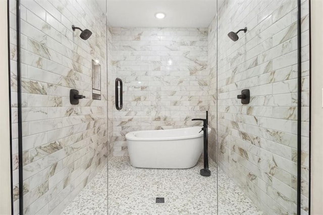 2608 NE Amanda Ln, Blue Springs, MO 64029 - full bathroom with a stall shower, a freestanding tub, tile walls, and recessed lighting