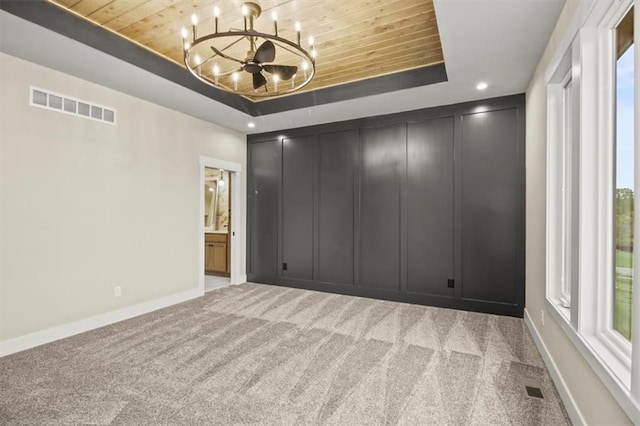2608 NE Amanda Ln, Blue Springs, MO 64029 - carpeted spare room featuring a raised ceiling, wood ceiling, a chandelier, and recessed lighting