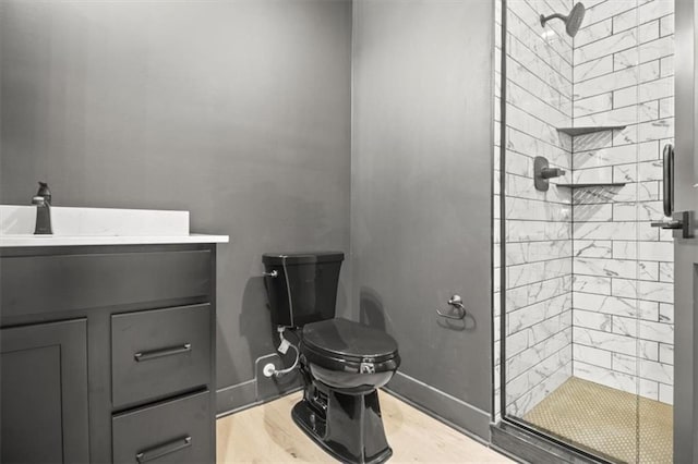 2608 NE Amanda Ln, Blue Springs, MO 64029 - bathroom featuring a stall shower, vanity, and wood finished floors
