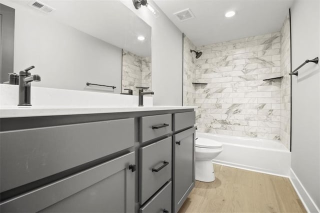 2608 NE Amanda Ln, Blue Springs, MO 64029 - bathroom featuring vanity, wood finished floors, recessed lighting, and shower / bath combination