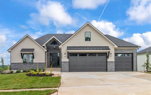 2608 NE Amanda Ln, Blue Springs, MO 64029 - view of front of property with concrete driveway, a front yard, a garage, and brick siding